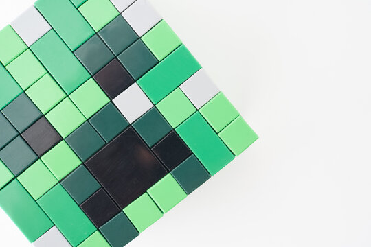 A green Lego Minecraft creeper head shot isolated on a white background. Bradford, UK Oct 2 2026