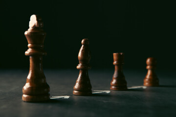 chess pieces on a dark background. business concept © Artvibe