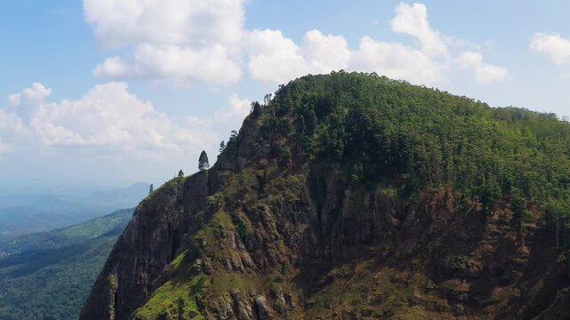 Aerial View of a Forested Mountain Peak and Rugged Cliffs in Sri Lanka