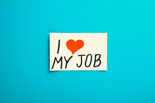 I love job text on paper note on blue background