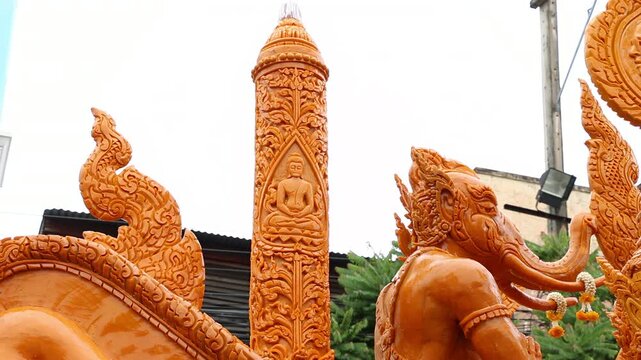 Beautifully carved wax float procession in Ubon Ratchathani Candle Festival, Thailand.