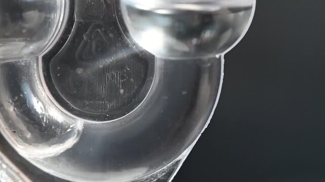 Fermentation lock used in alcohol production. Release of carbon dioxide, bubbling.
