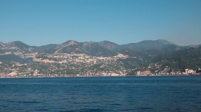 Sunrise over the Amalfi Coast from a boat