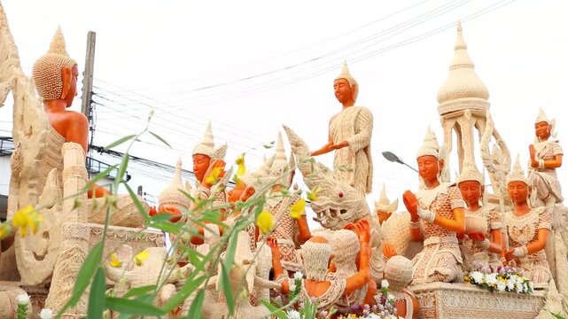 Beautifully carved wax float procession in Ubon Ratchathani Candle Festival, Thailand.