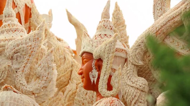 Beautifully carved wax float procession in Ubon Ratchathani Candle Festival, Thailand.