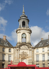Fototapeta premium The ornate clock tower and dome of the historic Town Hall building under a clear sky in Rennes, France.