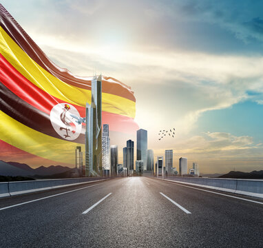 Uganda national national flag waving behind the cityscape.. Uganda national flag for independence day.