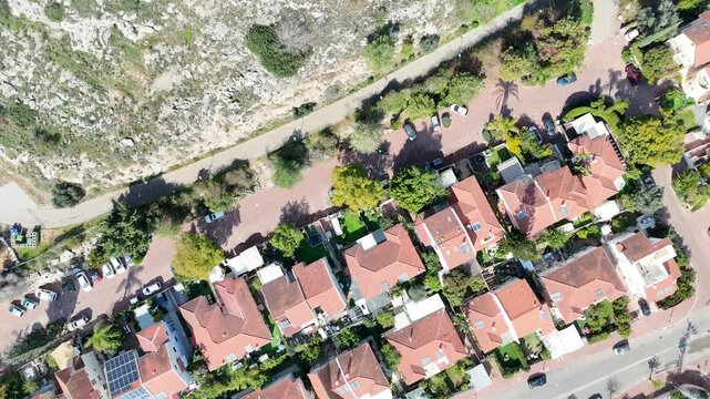 Top down aerial drone shot of luxury private houses and suburban neighborhood in Kochav Yair, Sharon region, Israel