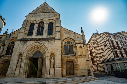 Historic Notre-Dame-en-Vaux church and traditional half-timbered architecture in Chalons-en-Champagne, France.