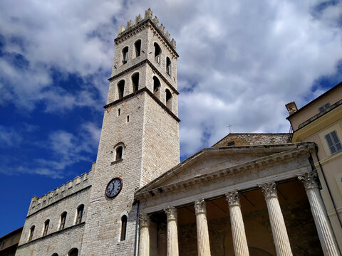 Temple of Minerva and medieval Torre del Popolo tower in Piazza del Comune in the city of Assisi, Italy