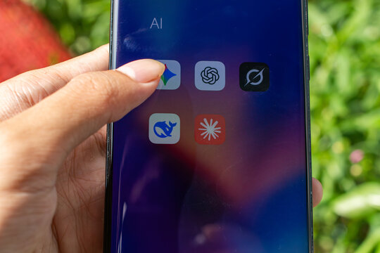 HO CHI MINH, VIETNAM - OCTOBER 24, 2024: Finger tapping Google Gemini AI chatbot app icon on a modern smartphone display screen