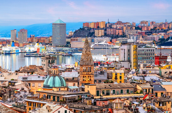 Genova, Italy downtown skyline  towards the port at dusk with historic and modern towers. 770