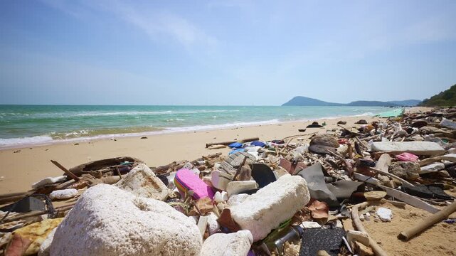 Plastic garbage polluting tropical sandy beach by the sea