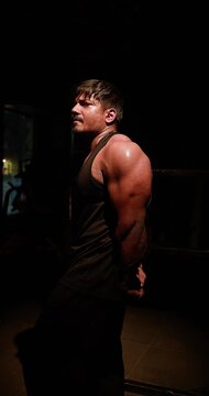 Muscular Bodybuilder Training Triceps With Weights During Gym Workout &mdash; Focused athlete completes multiple triceps repetitions with controlled movements, showcasing defined arms, strength development 