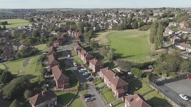 Aerial view of neat rows of brick houses. Industrial, demolition, Dewsbury Moor