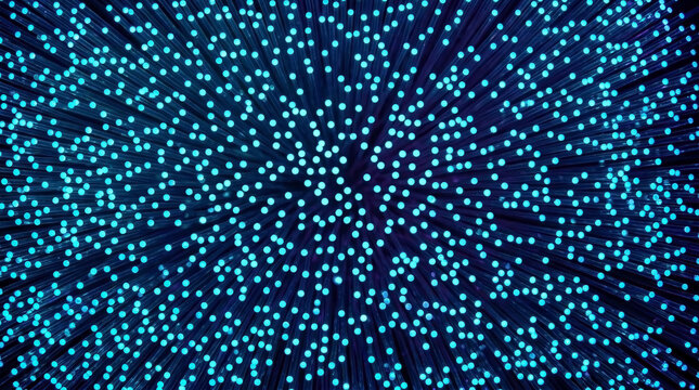 Glowing blue fiber optic cable bundle. Macro view of optical glass fibers transmitting light. High speed internet and digital telecommunication technology concept