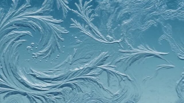 Frost patterns on glass video background, intricate ice crystals freezing texture, blue winter weather motion graphic, cold season background animation