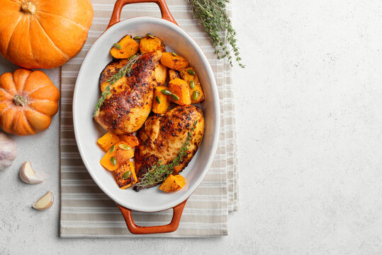 Autumn meal: roasted chicken and pumpkin with herbs