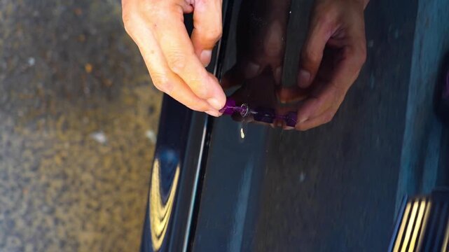Removing dents on the car. PDR technology. Car body repair without painting.