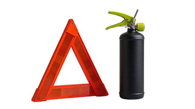 Orange reflective warning triangle and black fire extinguisher with green handle