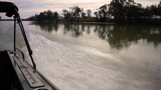 River Murray travel and tourism as a boat moves at speed along the water, captured from point of view shot. Australian river landscape and nature scenery for documentary or editorial