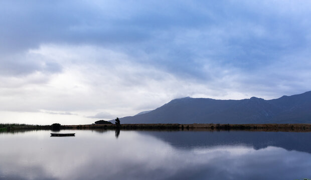 beautiful placid pond under muted overcast skies, Stanford, South Africa