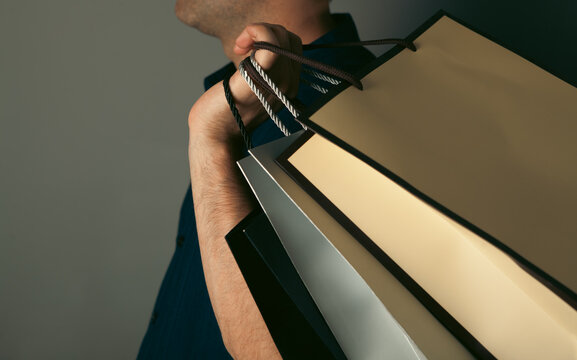 man holding shopping bag .