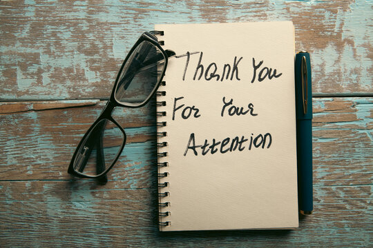 thank you message with napkin on wooden table.