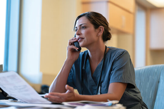 A compassionate nurse engages with a patient over the phone, demonstrating the significance of effective communication and guidance in healthcare services.