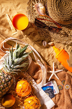 Egypt vacation concept with souvenirs and accessories. Beach sand background with copy space for text, flat lay