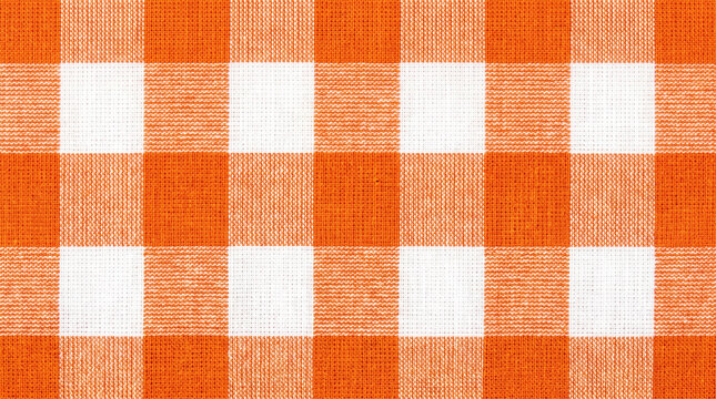 Orange gingham tablecloth fabric texture. Vintage plaid chequered check pattern. square fabric textile texture, picnic blanket background wallpaper