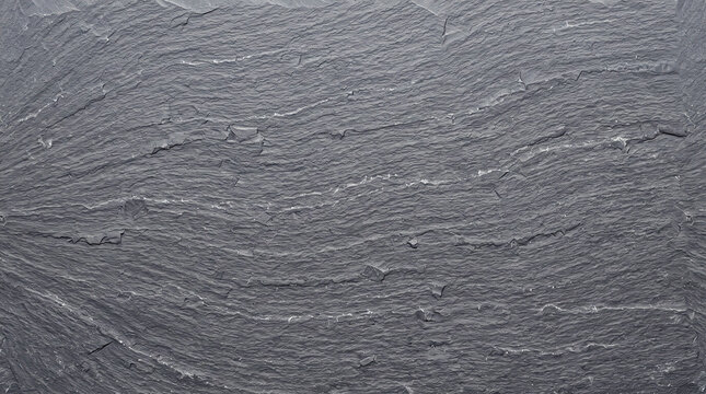 Natural dark grey slate stone texture with rough surface pattern.