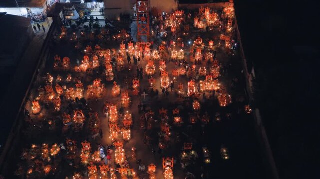 Aerial view of the cemetery in Arocutin illuminated by hundreds of candles during the Day of the Dead celebration in Arocutin, Michoacan, Mexico.