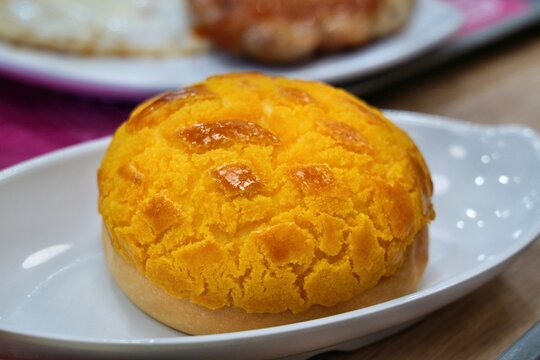 Pineapple bun - sweet bun with crust resembling pineapple surface. It doesn't contain pineapple. Hong Kong cuisine in China.