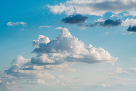 View of fluffy white cumulus clouds drifting across a bright blue sky in Novi Sad, Vojvodina, Serbia.