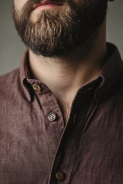 Dark shirt worn by man with a full beard