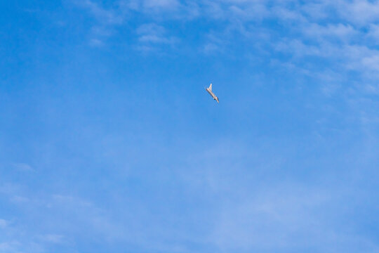 View of a fighter jet flying high in the clear blue sky above Mosnov, Moravian-Silesian Region, Czechia.