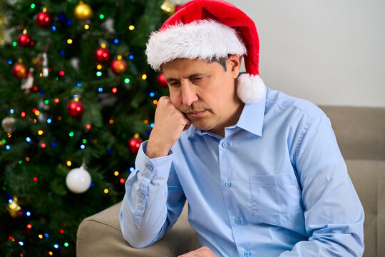 Sad,man and house on Christmas, past reflection on lonely holiday and nostalgia memory. Thinking, person and grief for cancelled plan, regret decision and emotional for festive season at home.