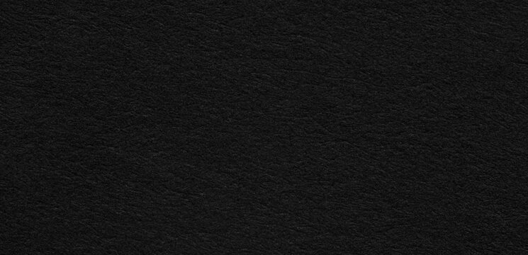 Macro Texture Background of Fine Black Paper Surface,A full-frame macro close-up background texture of a fine dark black paper or felt fabric surface. Ideal for luxury design, dark mode background, 