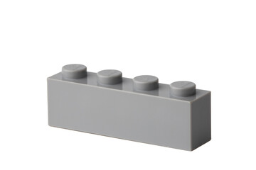 Gray brick piece on a plain background © fotofabrika