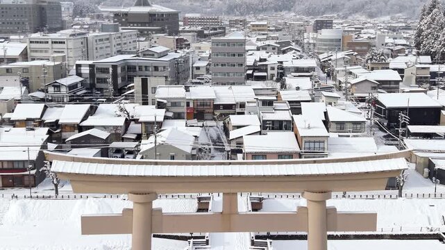 Aerial view of Takayama city blanketed in fresh snow during winter in the Hida region, Gifu, Japan.	