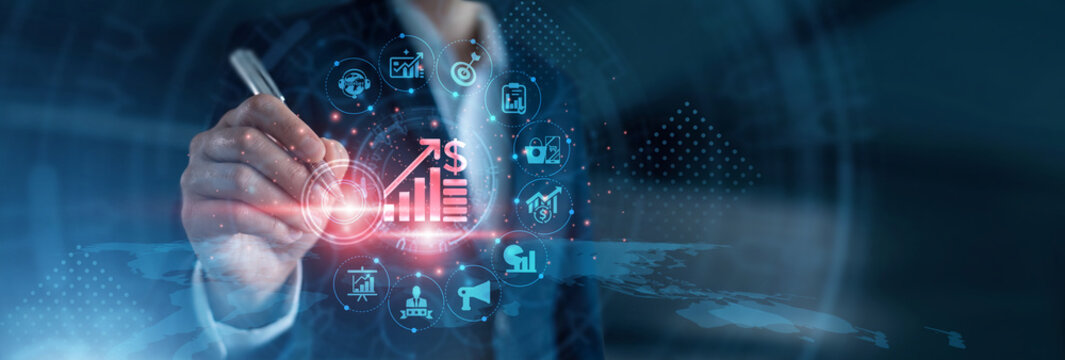 Revenue growth. Business analyst pointing using pen reviewing commercial sales performance graphs, conversion rate optimization metrics, and market expansion pipelines on digital screen.