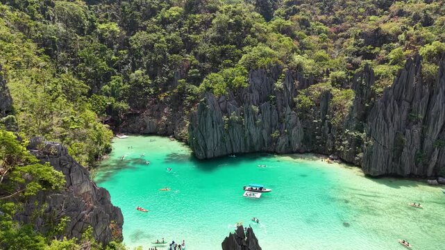 El Nido, Cadlao Island, Kayak tourism in the rock, Philippines. Aerial View. Video
