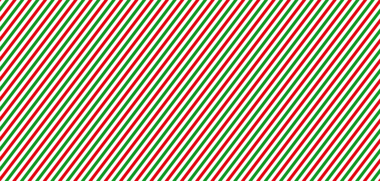 Christmas red, green and white diagonal stripes seamless pattern. Festive candy cane wrapping paper texture. Geometric vector background.