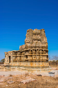 vertical image of broken temple at chittorgarh fort