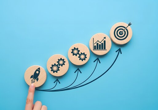 Business growth strategy with wooden tokens showing rocket and target icons connected by drawn arrows