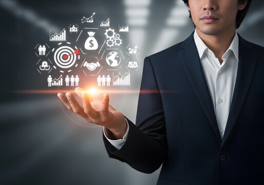 Businessman in a suit holding floating business strategy and growth icons above his open palm