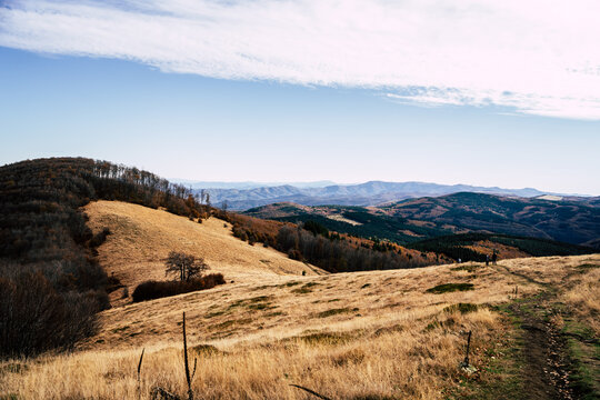 View of the rolling golden hills and mountain landscape near the Golyam Kademliya Shelter in Stara Zagora, Bulgaria.