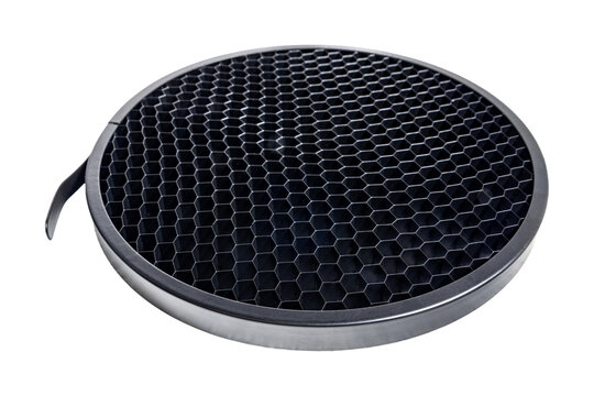 Circular honeycomb grid light modifier with metallic frame for precise directional control in professional photography lighting