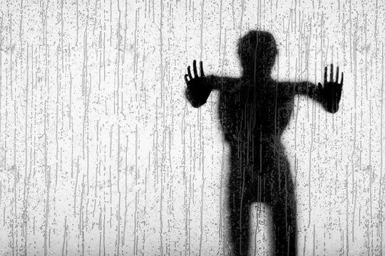 3D human figure pressing hands against rain covered glass in high contrast silhouette